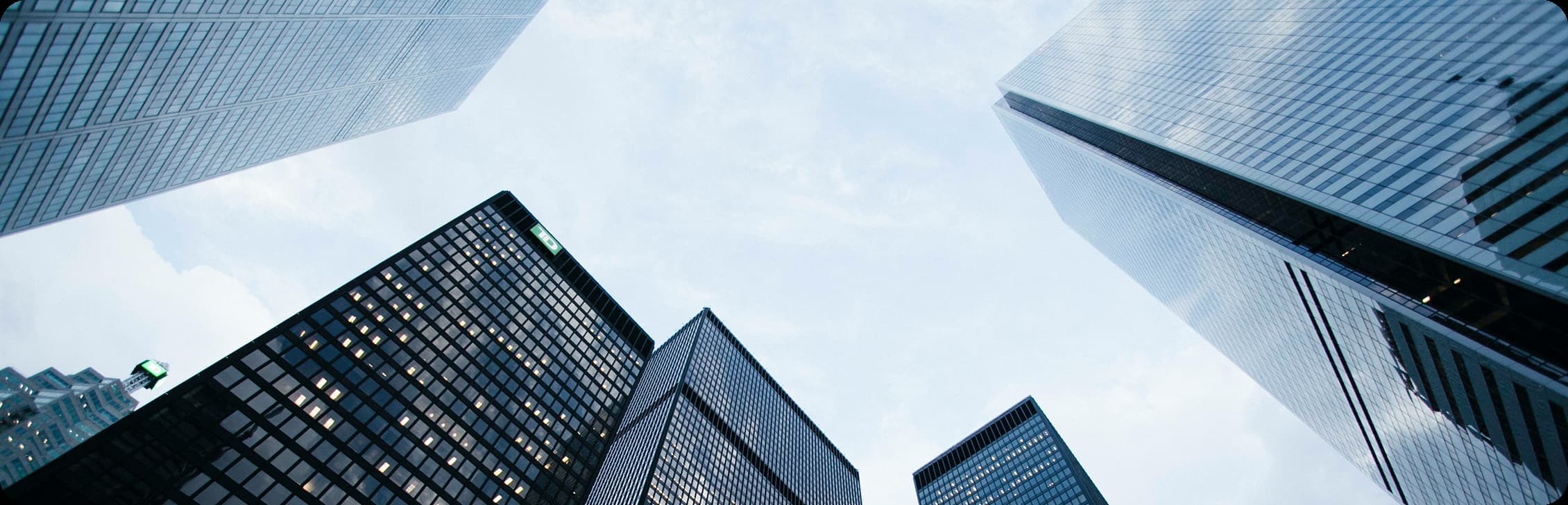 low angle photo of city high rise buildings during daytime